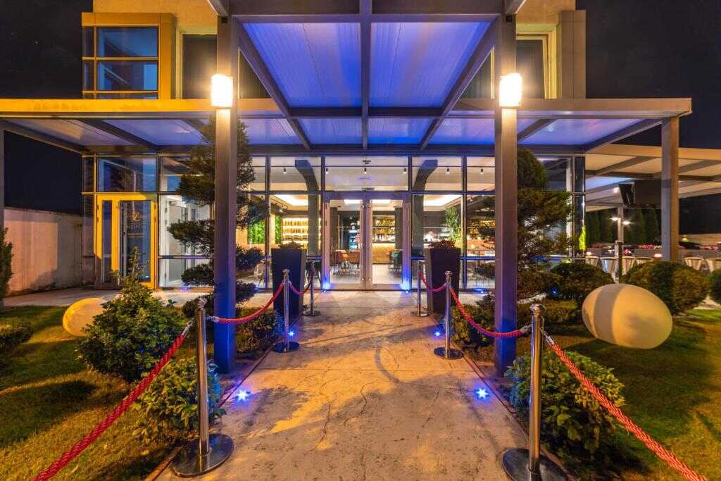 Illuminated entrance of Hotel Luka's in Berane at night