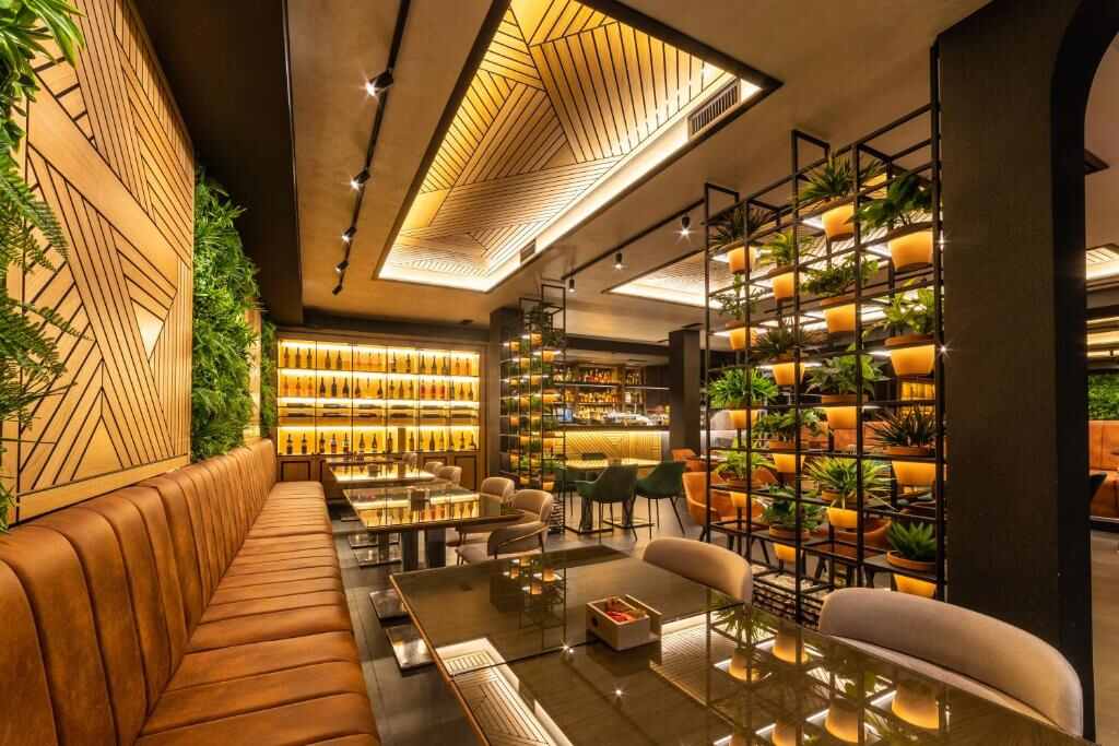 Restaurant of Hotel Luka's with leather seating and plants