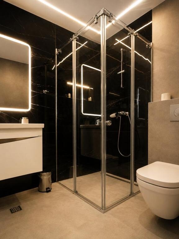 Modern bathroom with walk-in shower at Hotel Luka's
