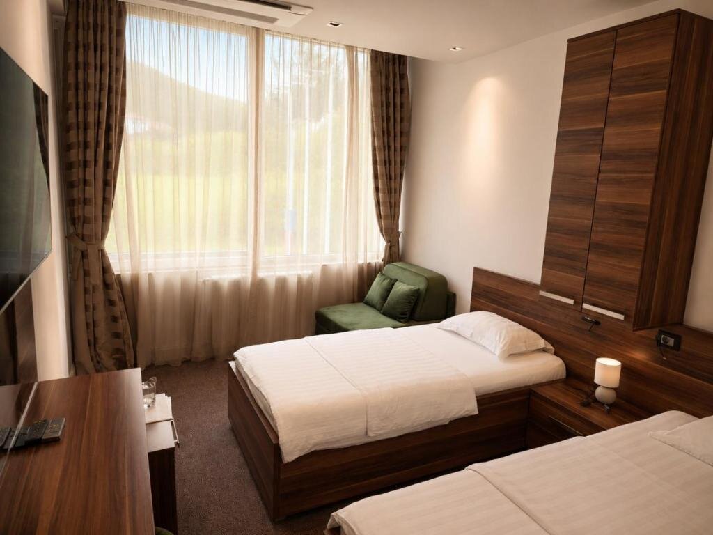Guest room at Hotel Luka's with mountain view